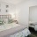 a bedroom with a large mirror