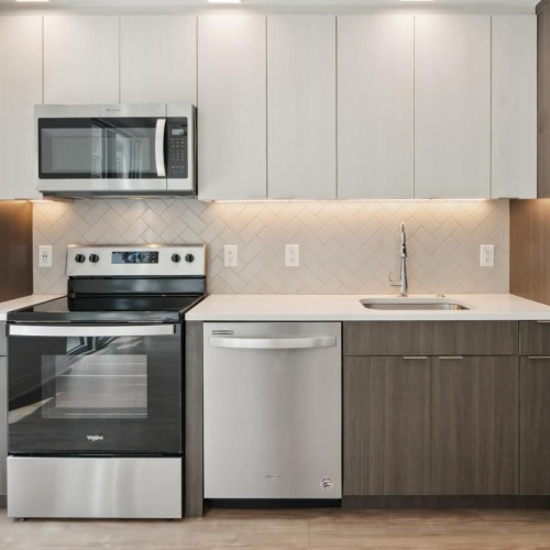 Spacious kitchens with thoughtful details a kitchen with stainless steel appliances
