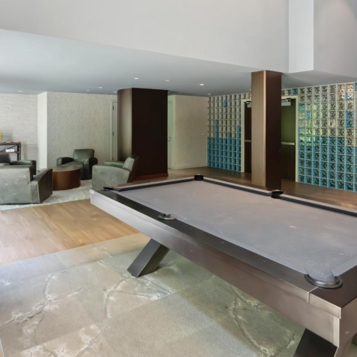 Everything within reach a room with a pool table and chairs